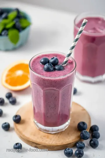 Blender Blueberry Smoothie with Zesty Twist presentation